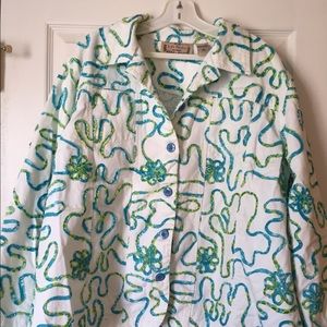 White jacket with blue-green embroidery